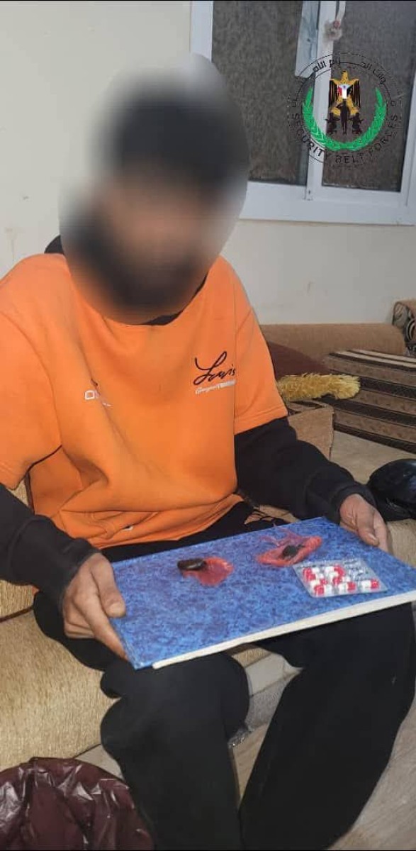The security belt forces, Lahj, seized a person in possession of narcotic substances and wines