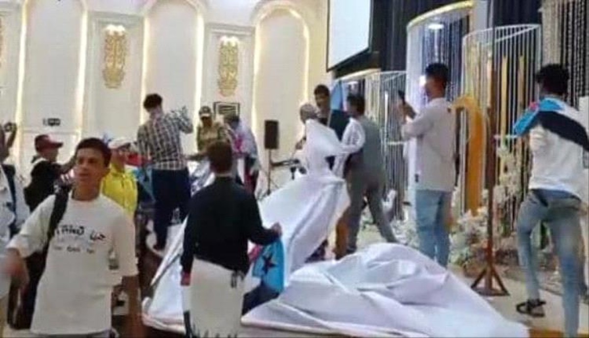 Storming the event hall of a youth conference in Aden and disrupting it