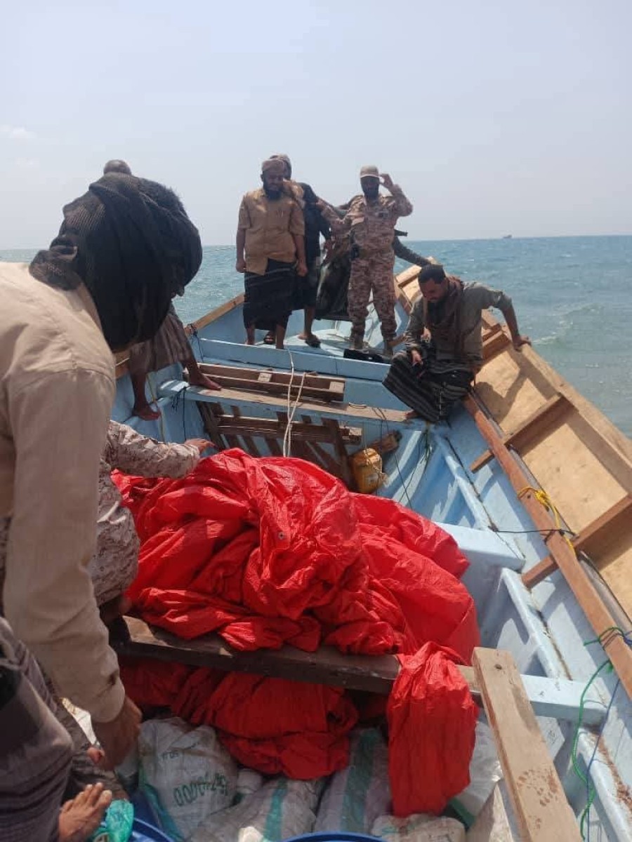 In pictures .. arms shipment was set on a boat on the coast of Ras Al -Ara, Belhaj