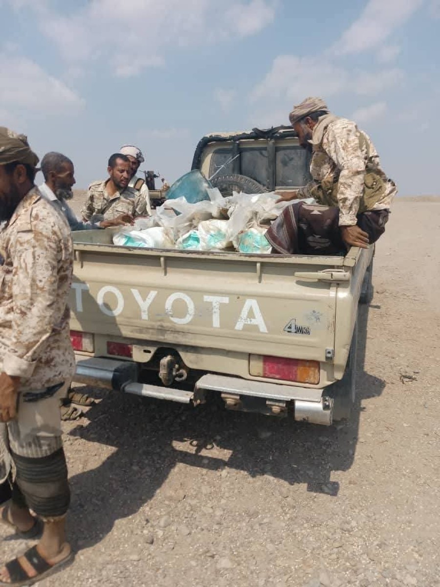 In pictures .. arms shipment was set on a boat on the coast of Ras Al -Ara, Belhaj