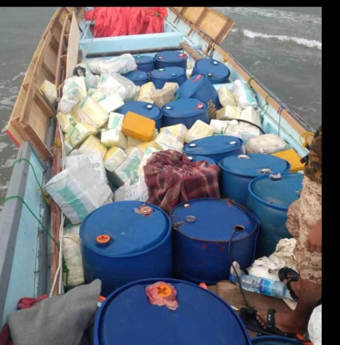 In pictures .. arms shipment was set on a boat on the coast of Ras Al -Ara, Belhaj